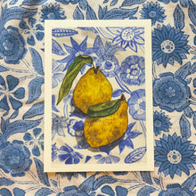 Load image into Gallery viewer, A5 giclee print with two yellow quinces on a blue floral patterned tablecloth