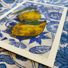 Load image into Gallery viewer, Giclee print of two Quinces on a blue floral patterned tablecloth, by Alice Savery of Alice Draws the Line