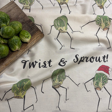 Twist and Sprout! Christmas tea towel by Alice Savery of Alice Draws the Line, illustrated Brussels Sprouts doing the twist. Unbleached organic cotton.