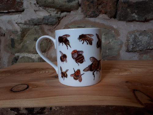 Bee mug by Alice Draws The Line. A china tea or coffee cup covered in bee illustrations