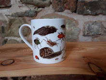 Load image into Gallery viewer, Bug Mug by Alice Draws The Line, a china cup covered in mini-beasts and creepy crawlies