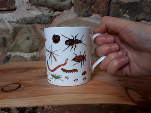 Bug Mug by Alice Draws The Line, a china cup covered in mini-beasts and creepy crawlies