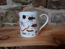 Load image into Gallery viewer, Bug Mug by Alice Draws The Line, a china cup covered in mini-beasts and creepy crawlies