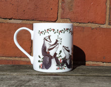 Load image into Gallery viewer, Christmas Badgers China Mug, Badgers with holly, ivy and mistletoe illustrations by Alice Draws The Line