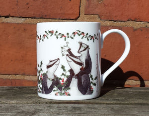 Christmas Badgers China Mug, Badgers with holly, ivy and mistletoe illustrations by Alice Draws The Line