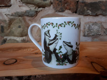 Load image into Gallery viewer, Christmas Badgers China Mug, Badgers with holly, ivy and mistletoe illustrations by Alice Draws The Line