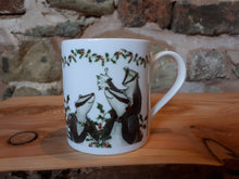 Load image into Gallery viewer, Christmas Badgers China Mug, Badgers with holly, ivy and mistletoe illustrations by Alice Draws The Line