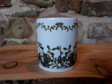 Load image into Gallery viewer, Christmas Badgers China Mug, Badgers with holly, ivy and mistletoe illustrations by Alice Draws The Line