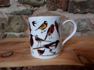 Garden birds China mug by Alice Draws The line including a blackbird, robin, woodpecker, magpie, wren, blue tit