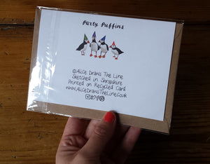 Party Puffins Greeting card by Alice Draws The Line, puffins in rainbow party hats, blank inside and printed on recycled card