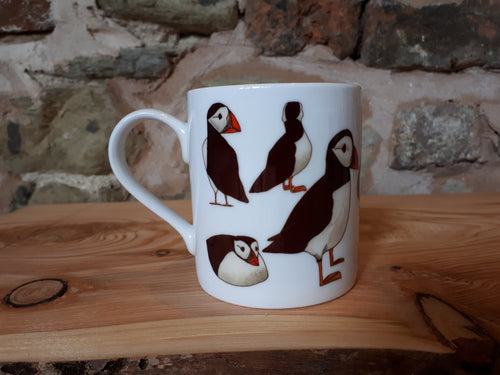 Puffin gift, a puffin mug with lots of cheery puffins to join you in your cup of tea or coffee